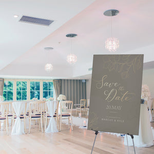 Silver Display easel at a wedding showing signage for the married couple. 