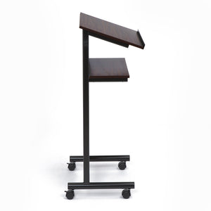 Wheeled Lectern with Storage Shelf - Cherry/Black - Compact Standing Desk for Reading - Laptop Stand. Shown at a side angle with metal frame showing. 