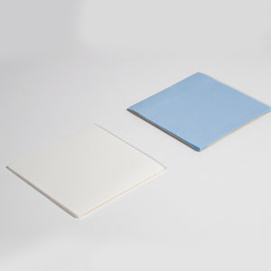 Reusable Dry-Erase Sticky Pads for any non-textured surface. Shown compare to standard post it note. 