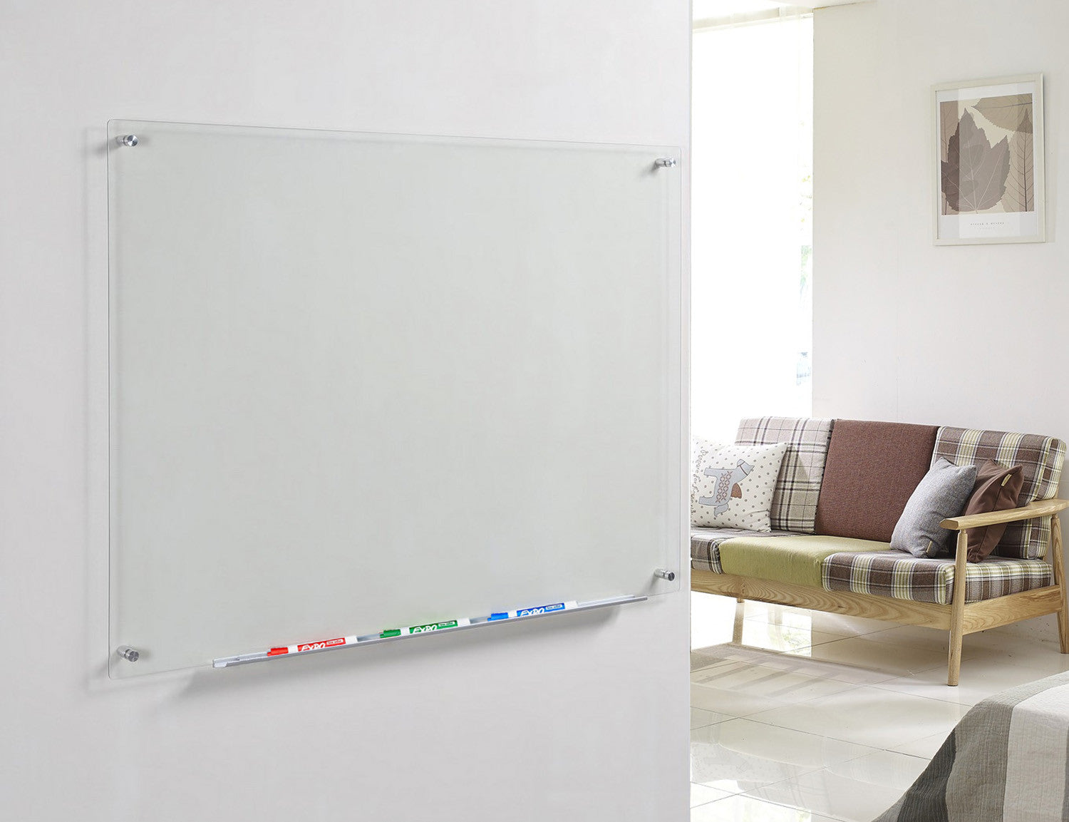 Clear Glass Dry-Erase Board with Aluminum Marker Tray. Wall mounted in a living room as a chore board. 