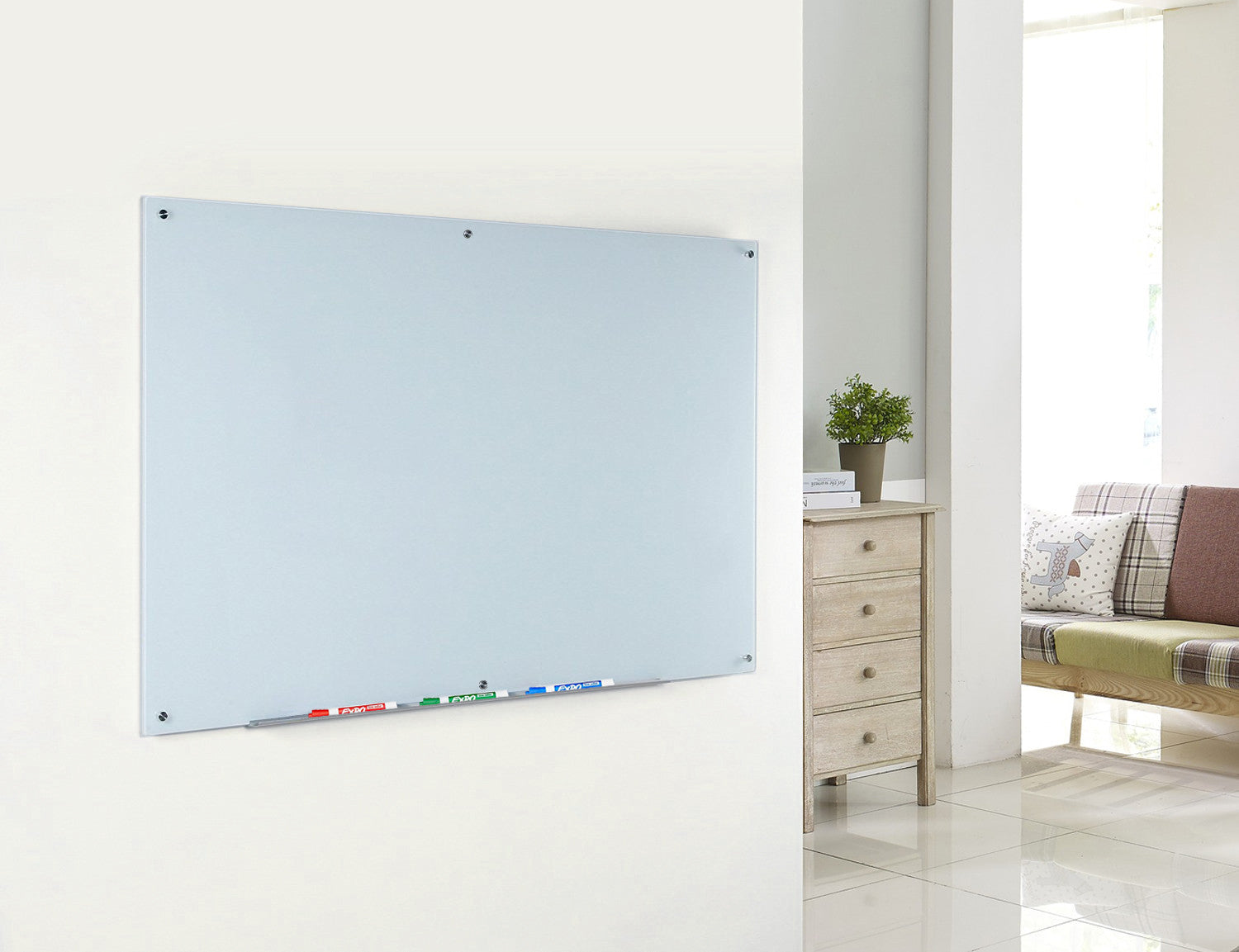 Magnetic White Glass Dry-Erase Board Set - Includes Board, Magnets, and Marker Tray. Wall Mounted in a living room for memo board use.