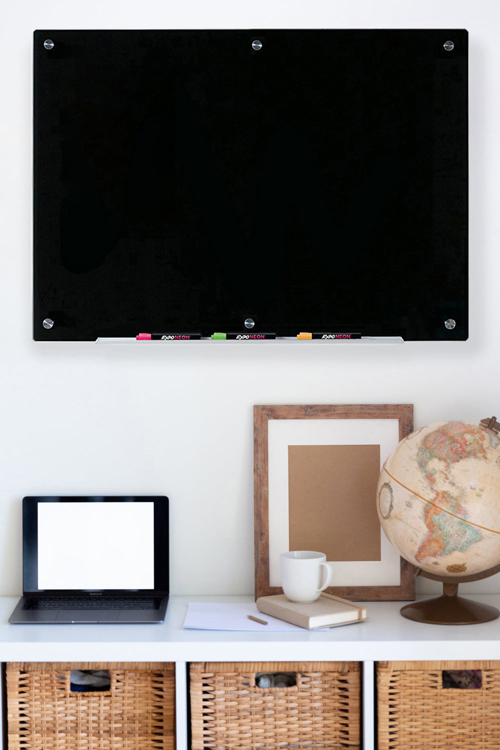Black Glass Board mounted in a home office above a desk. 