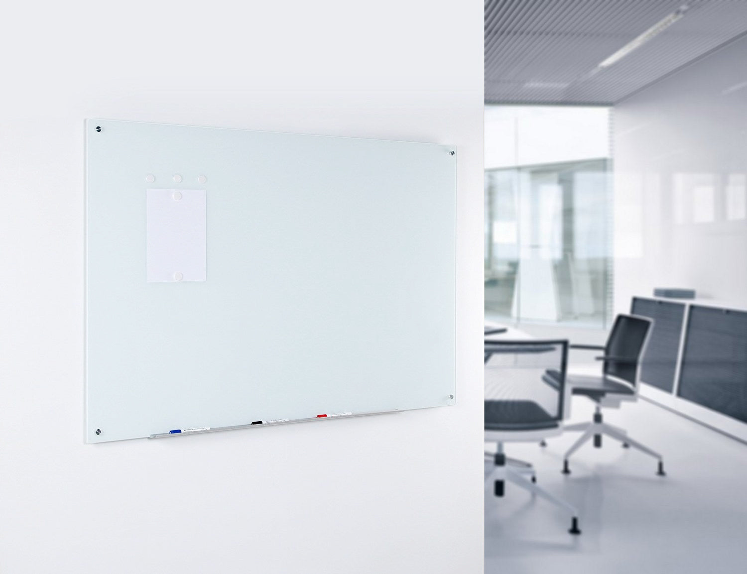 Magnetic Ultra White Glass Dry-Erase Board Set - Includes Board,  Neodymium Magnets, and Marker Tray. Shown holding documents with neodymium magnets in an office setting. 