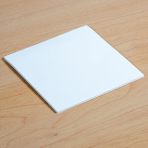 Reusable Dry-Erase Sticky Pads for any non-textured surface.. Shown on desk. 